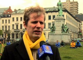 '比利时法轮大法学会负责人尼古拉斯·施厚斯先生(Nicolas  Schols)呼吁共同制止迫害。'