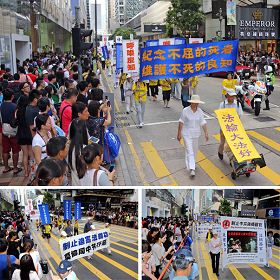 图6.制止迫害的游行,吸引广大民众和旅客的关心与围观,纷纷举起相机、手机拍照。