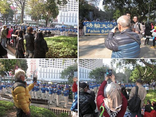 '图2.法轮功学员静等新年大游行期间,天国乐团演奏“法轮大法好”、“送宝”、“佛恩圣乐”等乐曲,吸引民众聚焦与拍照。'
