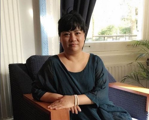 '图1:越南裔女士莉莉(Lily Tian)修炼法轮功后,一身病痛消失'