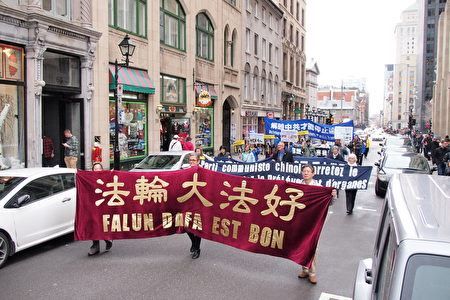 '图三-六,二零一七年四月二十二日,法轮功学员在加拿大蒙特利尔举行游行,纪念一九九九年四月二十五日万名法轮功学员和平上访'