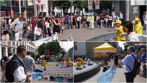 '图1:在安特卫普梅尔街大法弟子向民众展示法轮功功法,传播真善忍的美好,并告知民众持续十八年的发生在中国的迫害真相,呼吁民众共同制止迫害。'