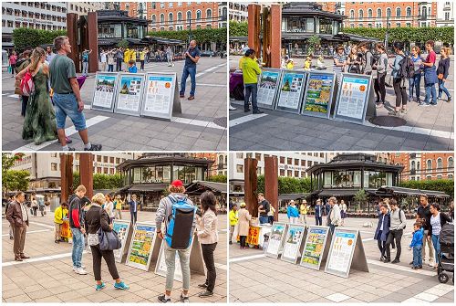 '图2:瑞典民众在仔细阅读真相展板、了解法轮功真相。'