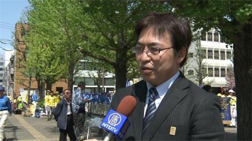 '图7:丸山会长在集会上致词'