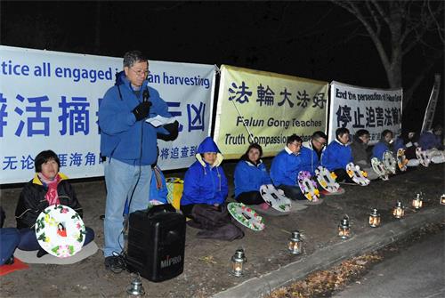'图2:堪培拉法轮功学员发言人刘松发博士谴责中共对法轮功长达二十年的血腥镇压和残酷迫害。'