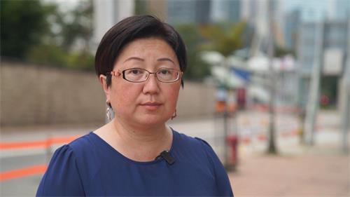 '图8:香港法轮功学员春微。'