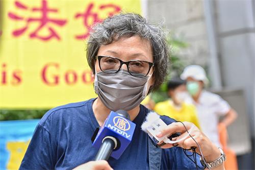 '图3:香港法轮功发言人刘惠卿呼吁各国政府及各界民众制止中共迫害法轮功,解体中共。'