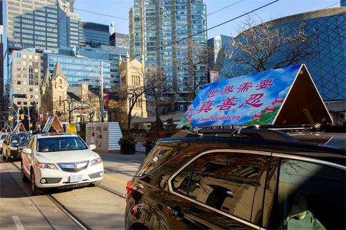 '图1~15:在全球剿共之际,二零二零年十一月十四日下午一点,多伦多法轮功学员在多伦多市中心举行了“解体中共,停止迫害法轮功”的大游行。'