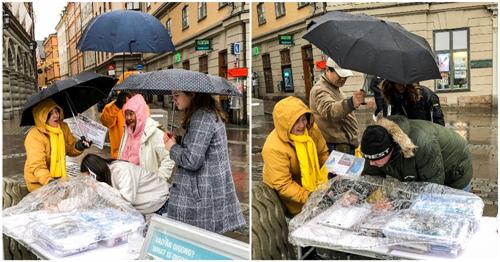 '图3:明白了真相的瑞典民众,冒雨用自己的签名来表达支持法轮功学员反迫害'