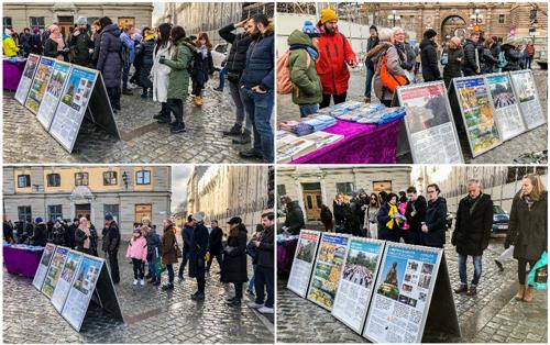 '图1:二零二零年二月二十九日,瑞典法轮功学员在斯德哥尔摩钱币广场设立真相点。真相展板吸引过往路人驻足观看、仔细阅读。'