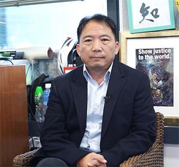 图6:民主党主席、立法会议员胡志伟