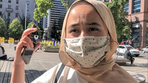 '图6:维族女孩Shalina说,中共对法轮功的迫害是件令人非常难受的事情'