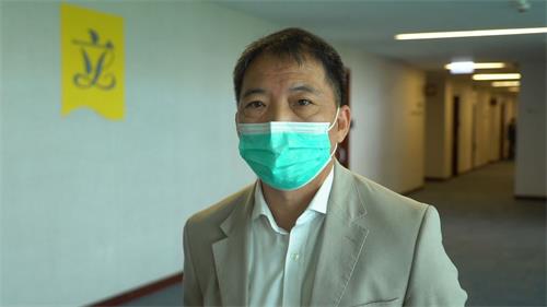 '图9:民主党主席、立法会议员胡志伟'