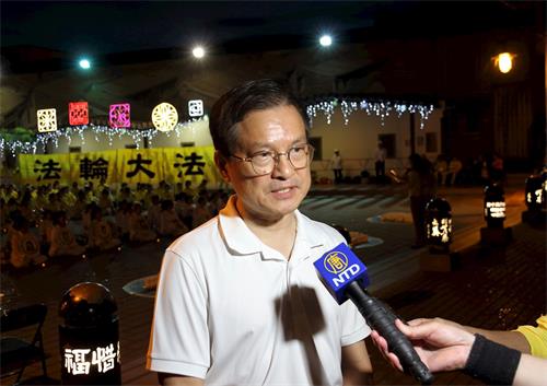 '图8:前彰化县县长魏明谷参加法轮功反迫害二十一周年烛光悼念活动。'