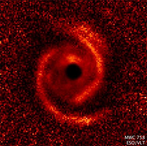 '婴儿“太阳系”MWC 758(Image credit:NASA / ESA / ESO / M. Benisty et al )'