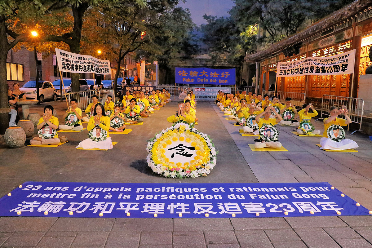 图1:二零二二年七月十九日,加拿大魁北克部分法轮功学员在蒙特利尔唐人街举行烛光夜悼
