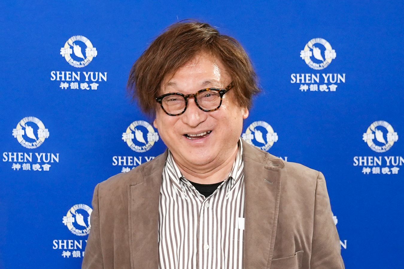'图6:二零二三年十二月二十三日晚上,医院院长池野宏观赏了神韵纽约艺术团在名古屋国际会议中心的演出。(新唐人)'