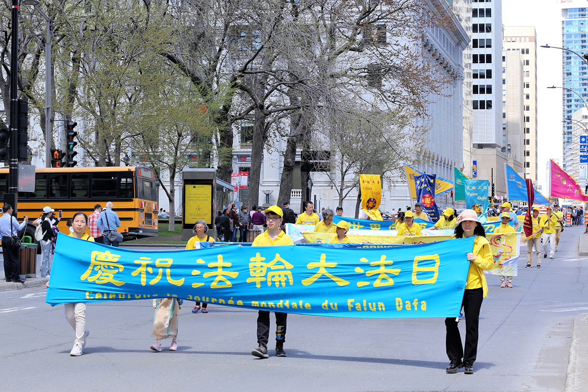 图1~5:二零二三年五月六日,加拿大魁北克省部份法轮功学员在蒙特利尔游行庆祝世界法轮大法日暨法轮大法弘传世界三十一周年,并恭祝法轮大法创始人李洪志大师华诞。图为游行队伍在行进途中。