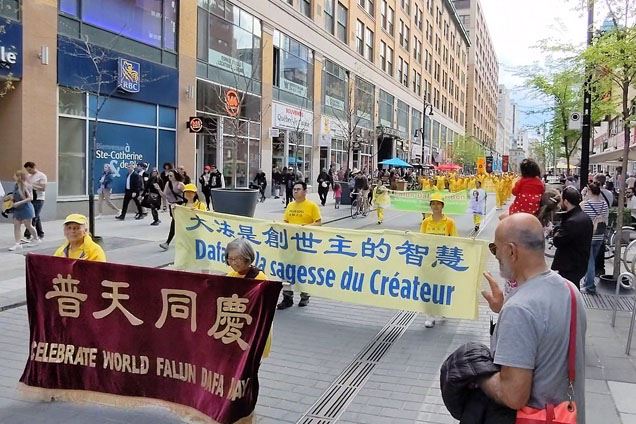 '图4~11:二零二四年五月十一日,加拿大魁省和安省的部份法轮功学员在蒙特利尔举行盛大游行,庆祝法轮大法弘传世界三十二周年暨第二十五届世界法轮大法日。'