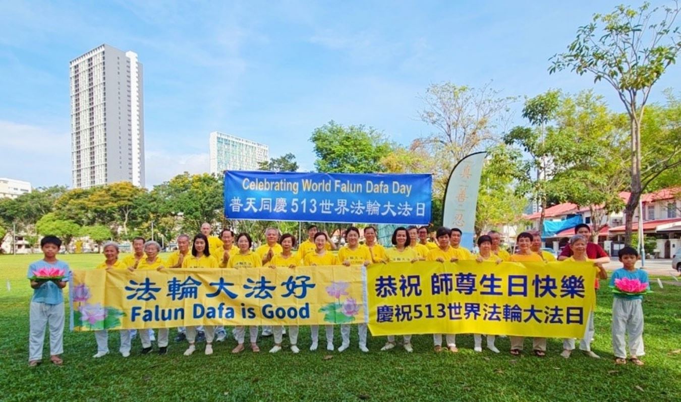 '图1:五月十二日,马来西亚北部槟城州(Penang)和吉打州(Kedah)法轮功学员在槟城州槟岛双溪里蒙休闲公园,欢庆“世界法轮大法日”,恭祝师尊生日快乐!'